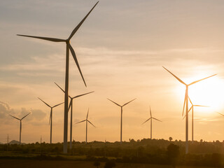 The silhouette of the Wind turbines and the beautiful sunset,Windmills and Landscapes, Renewable Energy Concept