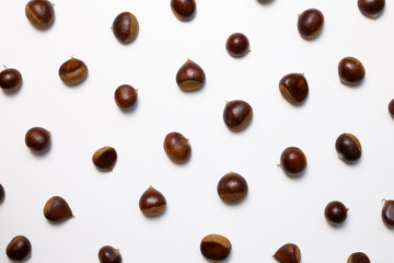 Chestnuts pattern background. Autumn and winter snacks. top view