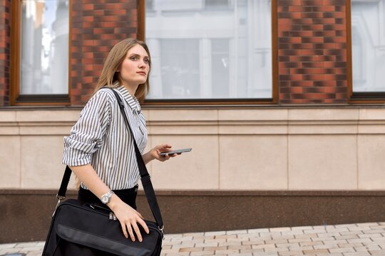 Young Business Woman Walking With Cellphone, Profile View Copy Space