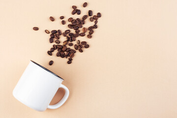 white cup on the table, top view, coffee beans