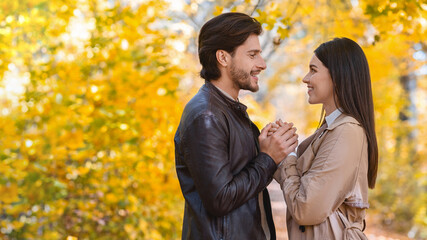 Beautiful lovers declare their feelings to each other at park