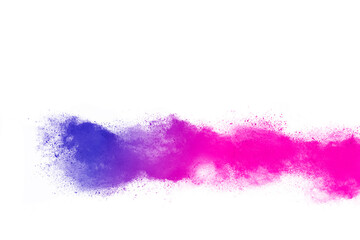 Freeze motion of colorful color powder exploding on white background. 