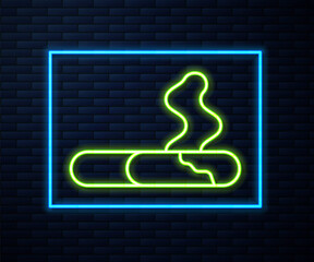 Glowing neon line Cigarette icon isolated on brick wall background. Tobacco sign. Smoking symbol. Vector.