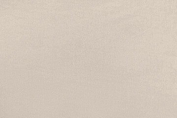 Peach homogeneous background with a textured surface, fabric.