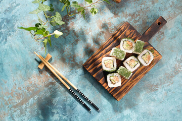 Unusual composition of rolls. A portion of rolls with an unusual filling. Top view of sushi.