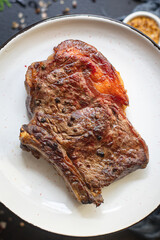 beef steak ribeye bbq grilled veal meat fried rare or medium tasty top view copy space for text food background rustic