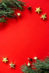 Christmas greeting card. Happy New Year. Christmas ornaments on red background. Merry christmas card. Space for text.