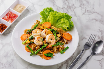Stir-fried rice noodles with soy sauce and shrimp
