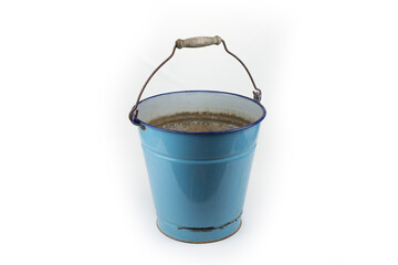 Old retro enamel bucket on a white