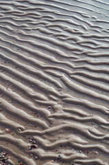 rippling sand under water.The texture of river sand from the waves.