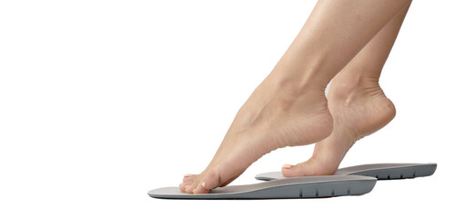 Female feet and insoles isolated on a white background.