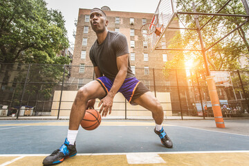 Basketball player training outdoors