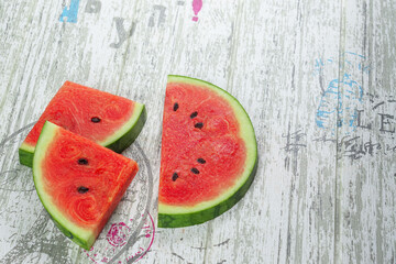 closeup of some pieces of refreshing watermelon on a Gray background