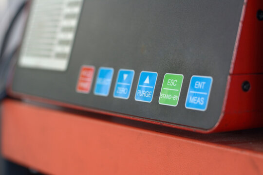 Digital diesel smoke tester at vehicle inspection station.