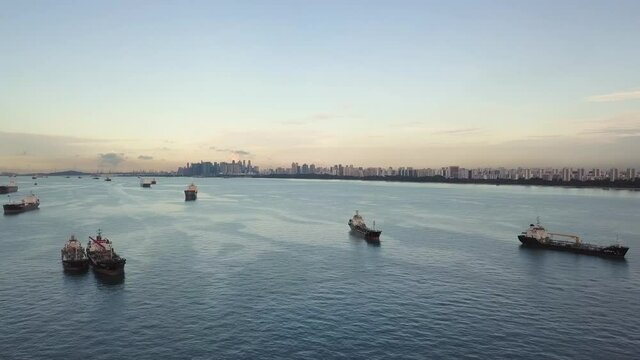 Aerial shot of Singapore coastline with city in background