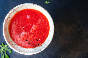 tomato soup carrots or peppers vegetable gazpacho portion in plate on the table serving size top view copy space for text keto or paleo diet food background rustic