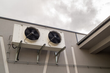 Two air compressors on a wall