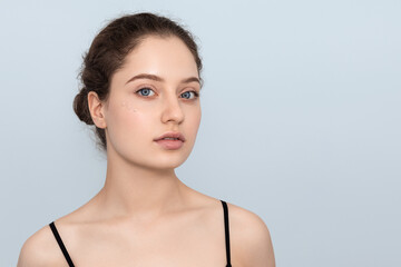 Young woman with a tone cream