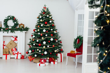 Christmas tree with fireplace interior of white room new year decoration garland gifts
