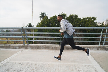 Portrait of an athletic man running.