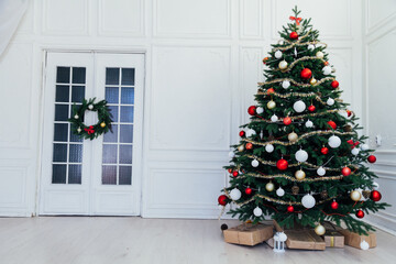 Christmas tree pine interior of the house new year decoration garland gifts