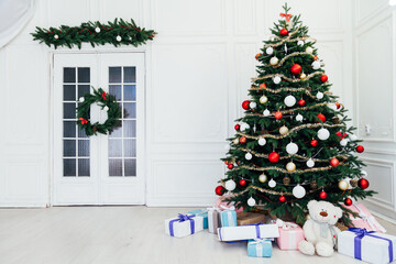 Christmas tree pine interior of the house new year decoration garland gifts