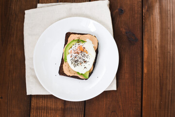 Healthy sandwich with poached eggs. Soft selective focus