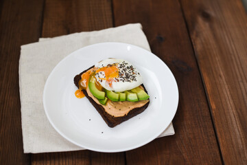 Healthy sandwich with poached eggs. Soft selective focus