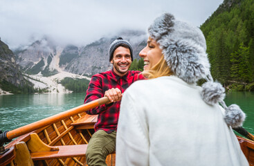 Couple of lovers at Braies lake, Italy