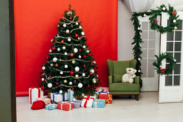 Fototapeta na wymiar Christmas tree pine red interior house new year decor garland gifts postcard