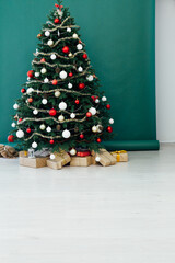 Christmas tree pine green interior room new year decor garland gifts postcard