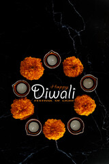 Happy Diwali day. Colorful traditional oil lamp diya on dark background.