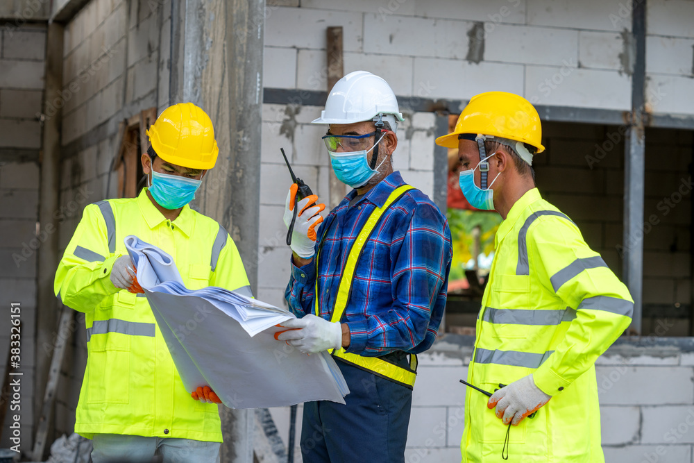 Aufkleber team of engineer discussing project details with blueprints at construction site.