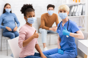 Fototapeta premium Doctor And Patient Gesturing Thumbs-Up After Coronavirus Treatment In Hospital