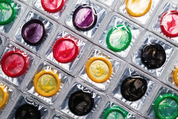 Colorful condoms background.