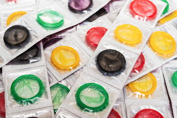 Colorful condoms background.