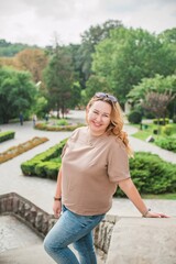 Obraz premium Happy smiling beautiful plus size model . Portrait large girl smiling on a sunny day with good mood, Photo of new age standard of beauty