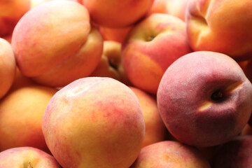 Fototapeta na wymiar Fresh ripe peaches as background, closeup view
