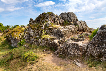 Fototapeta na wymiar Cambrian rock formation in Swietokrzyskie Mountains, near Checiny town and Kielce in central Poland, close to Checiny Royal Castle medieval fortress in summer season.