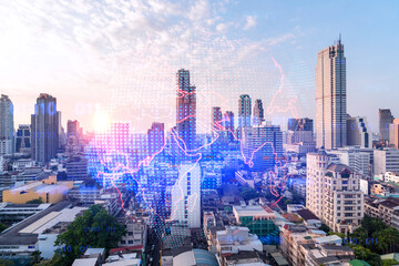 Glowing hologram of Earth planet map on aerial panoramic cityscape of Bangkok at sunset, Asia. The concept of international business. Multi Exposure.
