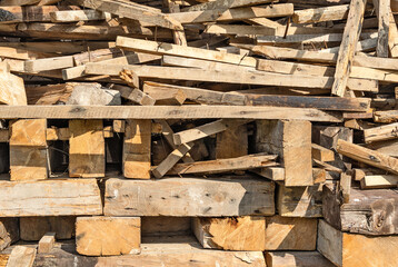 The used boards, bars and other lumber close up
