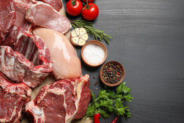 Flat lay composition with fresh meat on dark table