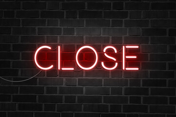 CLOSE red neon sign on brick wall