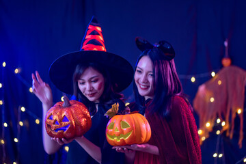 young Asian woman wearing costume in Halloween festival party