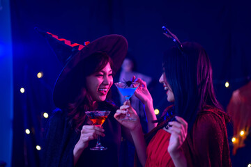 young Asian woman wearing costume in Halloween festival party