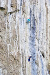 Climbers on a big limestone wall