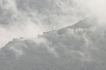 residential mountain hidden in clouds