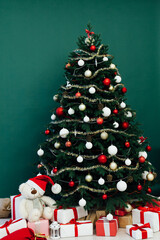 Christmas tree pine green interior room new year decor garland gifts postcard