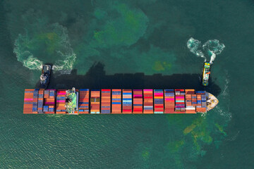 Container , container ship in export and import business and logistics. Shipping cargo to harbor by...