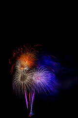 Beautiful colorful isolated firework display for celebration happy new year and merry christmas on black background